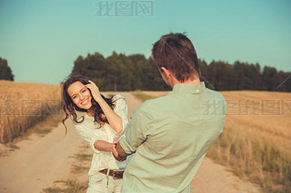 Young couple in love outdoor.in summer in field.le hugging.Young beautiful couple in love stayin