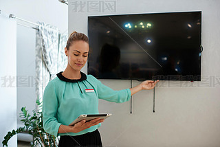 Young businesswoman points to the tv screen