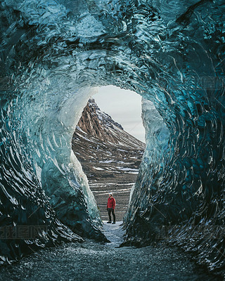 Treler with a backpack in an ice ce. Man standing on the glacier Vatnajokull in Iceland. Epic la