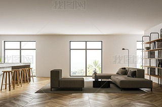 Interior of modern living room with white walls, concrete floor, white sofas and kitchen to the left