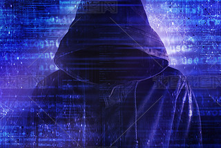 Cybersecurity, computer hacker with hoodie