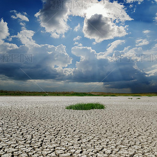 drought earth under rainy clouds