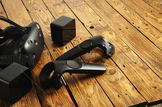 VR equipment set presented on wooden table