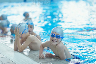 Happy kids at swimming pool