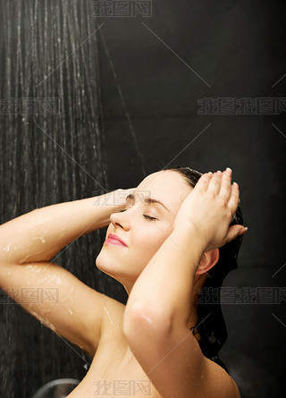 Woman standing at the shower.