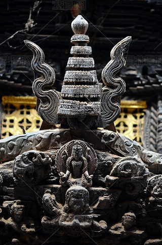 Carved wooden details on a Nepalese temple door