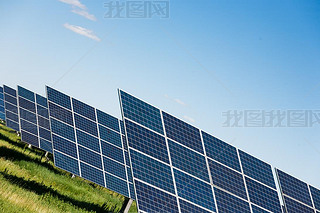 Solar panels against blue sky background