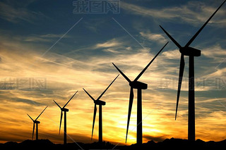 Wind turbines in a sunset