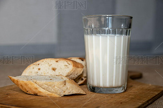 glass Cup with milk and sliced bread