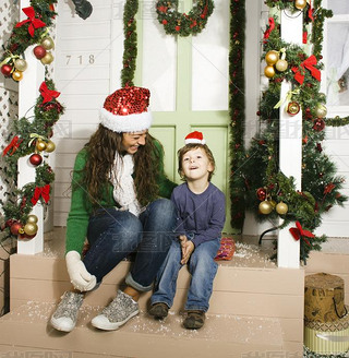 Happy family on Christmas in red hats