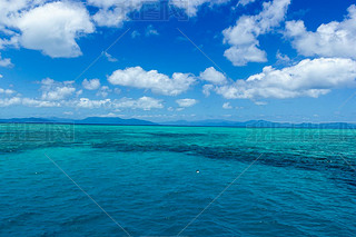 beautiful great barrier reef with white clouds on a sunny day, cairns, australia