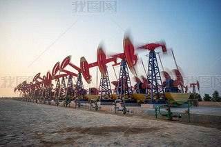 working oil-rig in oilfield in clear sky