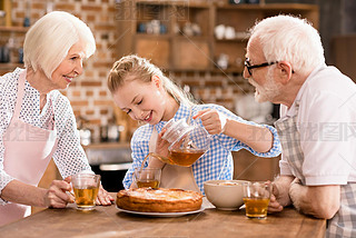 family drinking tea at home