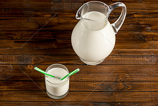 Fresh milk in glass and jug 