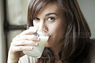 Young Woman Drinking Milk