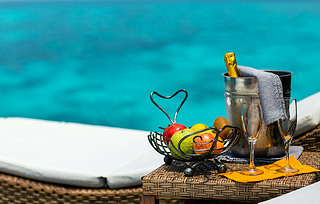 Two glasses with champagne  and fruits