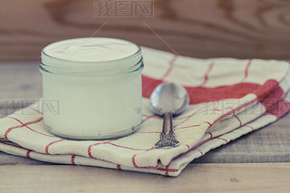 Greek Yogurt on a vintage wood background