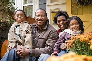 Family in front of house