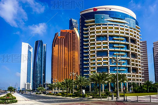 Abu Dhabi Picturesque Breathtaking Highrises with Blue Windows and Palm Trees