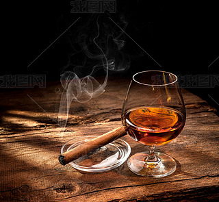 Whiskey with oking cigar