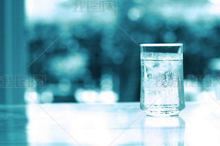 glass of Cool fresh drink with ice cube on the  table