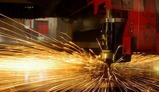 Laser cutting of metal sheet with sparks