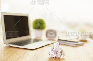 Crumpled paper on office desk