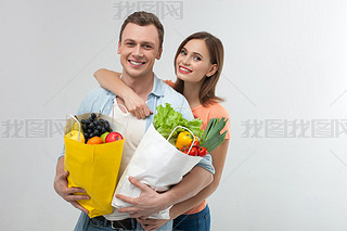 Cute young family is shopping together with joy