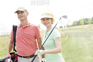 female friends standing at golf course