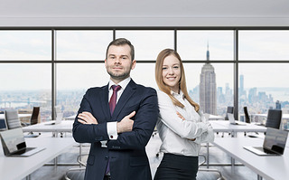 le of young managers are standing in the modern panoramic office. New York, Manhattan panoramic 