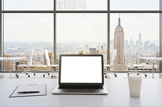 Front view of the workplace in a modern panoramic office in New York. White tables and white chairs.