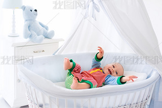 Cute baby in white nursery