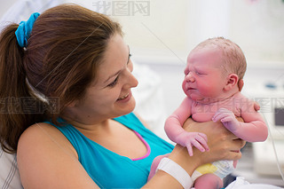 Young mother giving birth to a baby