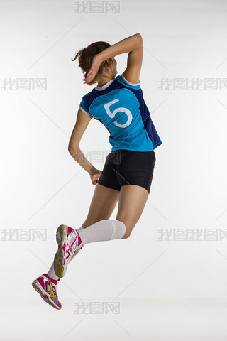 young athletic volleyball player returns the ball