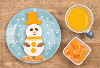 Funny sandwich for kids in a shape of a snowman 