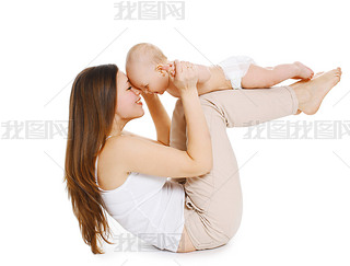 Young mother and baby are doing exercise and hing fun on a whi