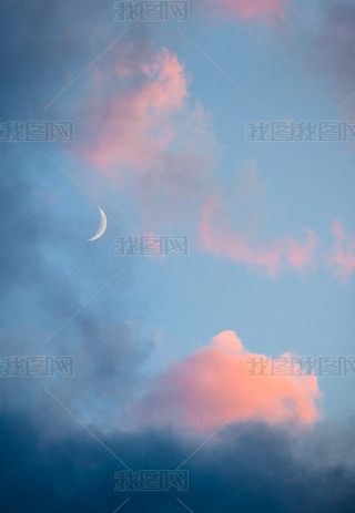 Pink clouds and moon heen closeup