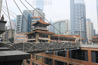 View of one of the two 68.5-meter-high suspended bridges connecting two high-rise buildings in Chong