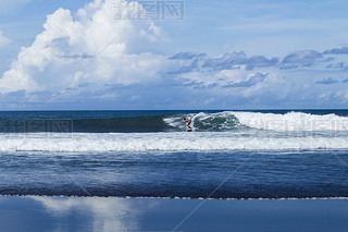 Surfer at the we in Bali surfing spot
