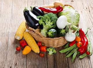 Mix green vegetables in wicker basket