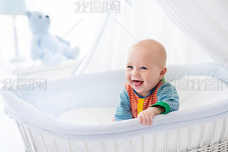 Cute baby in white nursery