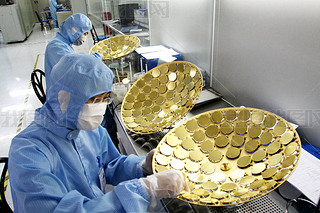Workers manufacture LED chips in the clean room at the plant of Shandong Inspur Huaguang Optoelectro