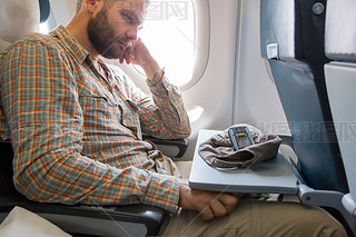 Tired Treler at Airplane Passenger Chair