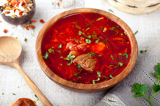 Traditional Ukrainian Russian vegetable soup, borsch with garlic donuts, pampushki .