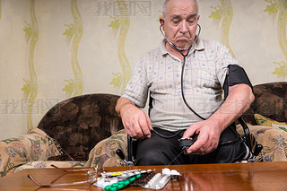 Thoughtful Old Man with Blood Pressure Apparatus