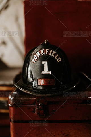 Vertical closeup shot of a firefighter helmet with Yorkfield and the number 1 written on it