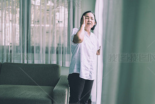 Mature asian elderly woman hing a headache pain at home,Senior healthy concept