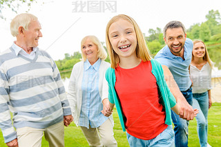 little girl enjoying time with her family