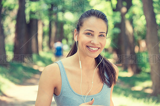 Portrait running young woman. Attractive fitness model outdoors.