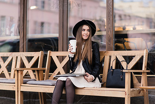 Trendy woman resting after work on net-book